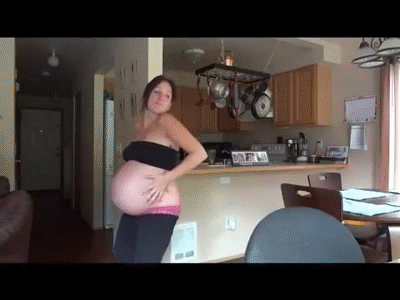 Housewife show her pregnant belly